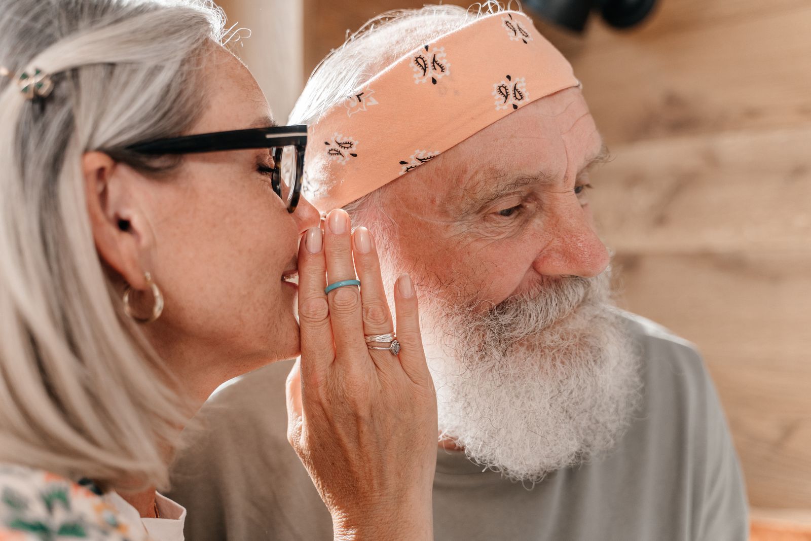 An older couple sharing a close, quiet moment together